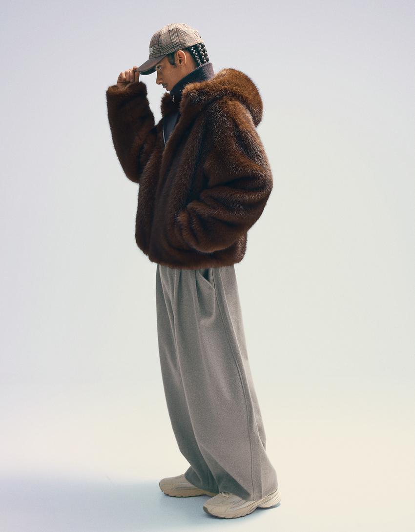 Blouson fausse fourrure à capuche